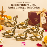 Brass peacock handle diya displayed for return gifts, festive gifting, wedding gifts and bulk orders.