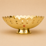 Decorative brass fruit bowl with scalloped cutwork design and pedestal base, ideal for serving fruits, dry fruits, snacks, and festive table décor.