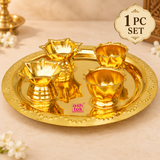 Single set brass puja thali with round tray and four diya holders, presented on a clean beige studio background.