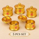 Set of 5 Brass Sindoor Boxes displayed together on a premium beige background, featuring matching round containers with decorative hinged lids and polished golden finish, suitable for festive gifting, return gifts and religious occasions.