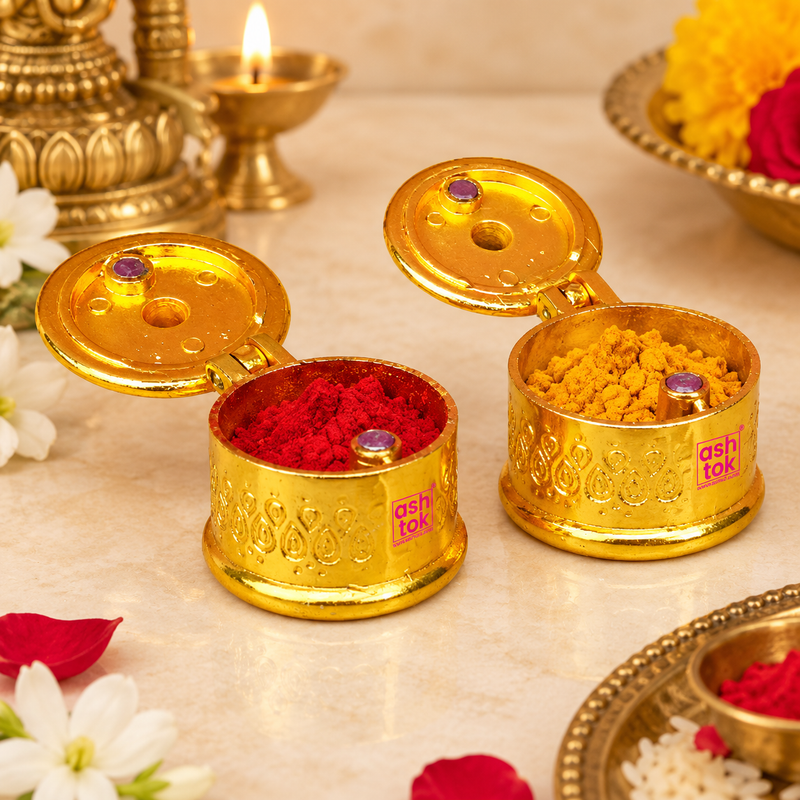 Brass Sindoor Box shown in a traditional puja setting with red kumkum and yellow haldi inside the open containers, surrounded by diya, flowers and devotional decor for daily worship, festivals and religious ceremonies.