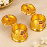 Detailed close-up of Brass Sindoor Box with hinged lids open, showing the smooth golden interior, embossed outer pattern, polished round base and small inner decorative details, highlighting the craftsmanship of the traditional kumkum container.