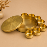 Handcrafted brass spice box (masala dabba) with engraved peacock lid and removable brass containers, ideal for organizing Indian spices, herbs, dry fruits, and kitchen essentials.