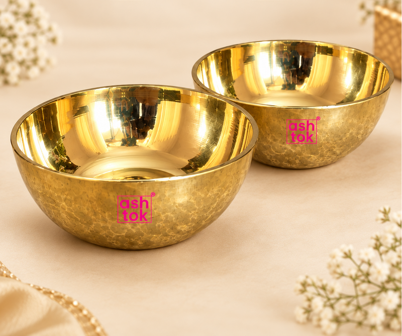 Image of Brass Sweet Bowl Set showing two round brass bowls with shiny polished inner surface and textured outer finish on a beige background, highlighting product craftsmanship and elegant brass look.