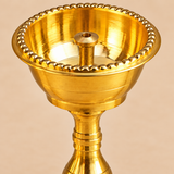 Features image of a Brass Udupi Nanda Diya highlighting the beaded decorative rim, deep diya bowl, pure brass finish, central wick holder, and stable round base on a clean beige background.