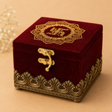 Burgundy velvet wood box with intricate gold filigree design and decorative clasp