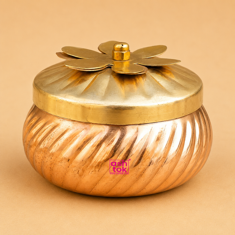 Decorative copper storage container with brass flower lid, ideal for dry fruit storage, return gifts, festive gifting, pooja essentials, and home decor by Ashtok.