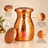 Features image of hammered copper carafe highlighting the fitted lid, handcrafted hammered copper finish, decorative beaded detailing and 400 ml capacity for everyday water storage and serving.