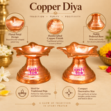 Professional features image showcasing two traditional Copper Diyas with elegant flower-shaped bowls, polished reddish-copper surfaces, decorative petal edges, and sturdy tapered pedestal bases. Each diya features a beautifully formed shallow bowl surrounded by multiple outward-curving floral petals that create a distinctive star-shaped appearance. The natural copper colour and reflective surface highlight fine handcrafted-style metal textures, subtle surface variations, and warm copper-orange metallic tone