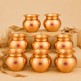 Set of eight polished copper kalashes arranged on displays with gift boxes for return gifting.