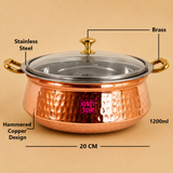 1200ml hammered copper and stainless steel serving handi with transparent glass lid, brass knob, brass handles, 20 cm diameter, and material specifications, ideal for serving biryani, curries, rice, and traditional Indian dishes at home, hotels, restaurants, and catering.