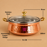 800ml hammered copper and stainless steel serving handi with transparent glass lid, brass knob, brass handles, and 16 cm diameter, ideal for serving biryani, curries, rice, and traditional Indian dishes at home or restaurants.