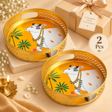Set of 2 Cow Design Tray Flower Baskets and Puja Trays for Temple displayed together in a premium beige gifting setup. Each round tray features a golden finish, decorative cutwork border, easy-carry side openings and traditional white cow artwork with palm tree detailing, making the set suitable for festive gifting, housewarming, return gifts, religious functions and temple use.