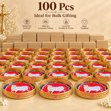 Bulk presentation of 100 Cow Design Tray Flower Basket and Puja Tray for Temple showing multiple trays arranged in front of plain stacked boxes in a premium beige setup. Each tray has a decorative golden cutwork rim, round tray form, colorful sacred cow center design and ASHTOK logo, making it suitable for wholesale orders, festival gifting, temple events, return gifts, corporate gifting and large quantity traditional gift distribution.