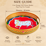 Size guide for Cow Design Tray Flower Basket and Puja Tray for Temple showing approximately 10 inches diameter and 2 inches height. The image clearly presents the round tray with measurement arrows, golden decorative cutwork border, colorful sacred cow design in the center and visible ASHTOK logo on a premium beige background for easy product dimension reference before purchase.