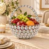Crystal Basket German Silver used as an elegant fruit basket in a premium home decor setting, beautifully filled with apples, green grapes, red grapes and orange while showcasing the sparkling crystal-studded body, silver-tone decorative framework and crystal handle, ideal for dining tables, console tables, festive displays, fruit presentation and sophisticated home decoration.