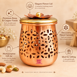 Features infographic image of a premium decorative dry fruit gift jar box highlighting its elegant flower lid, polished copper and golden finish, decorative floral cutwork body, multipurpose storage use and suitability for gifting. The jar is shown prominently on a soft beige studio background with clean feature callouts surrounding the product to help customers understand its design and utility. 