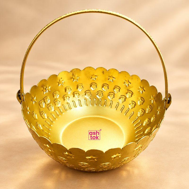 Gold coated flower gift basket with handle displayed on a premium beige studio background, featuring a round decorative basket body, scalloped flower-style rim, embossed star and floral motifs, polished golden finish and a tall curved carrying handle.