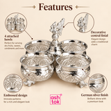 Feature image of a German silver chopala gift item showing 4 attached bowls with detailed product callouts, highlighting the four-bowl attached design for serving dry fruits, sweets, mouth fresheners and small items, the decorative central finial for traditional styling, the embossed surface pattern for a rich handcrafted look and the polished German silver finish for a premium elegant appearance, all presented on a beige background with ASHTOK branding in an informative ecommerce-friendly format.