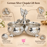 Feature image of German silver chopala gift item highlighting its three utility bowls, decorative center finial, embossed traditional design, raised ornamental feet and elegant handcrafted appearance, presented on a beige background with ASHTOK branding and descriptive callouts, showing how the product combines traditional aesthetics with practical use for kumkum, haldi, chawal, small pooja accessories, gifting and festive home décor.