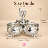 German silver chopala gift item shown with size guide on a beige background, featuring three embossed bowls with decorative feet and a carved central finial, with clear measurement markings indicating 5 inches diameter and 5.5 inches height, designed to help customers understand the overall product size for gifting, display, festive use, storage of small pooja items or dry snacks, and decorative tabletop placement.