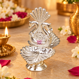 German Silver double swan diya displayed in a festive pooja setting with flowers, warm lighting and traditional decor accents, showing the polished silver finish, twin diya bowls and decorative swan motif as a beautiful accessory for daily worship, Diwali celebrations, festive table decoration, home temple use and ceremonial spiritual arrangements.