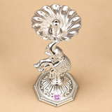Top view of a German Silver Elephant Pooja Diya showing the flower shaped diya bowl with petal style curves, central wick holder and the decorative elephant figure beneath, photographed on a beige studio background to clearly display the bowl shape, symmetry and overall design for customers looking for elegant pooja accessories, festive decor and traditional gift items.