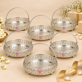 Multiple German Silver Flower Butti decorative baskets displayed together for bulk and gifting requirements, each featuring an ornate silver finished round body, floral cutwork sides, engraved base, raised feet and curved carrying handle, suitable for wedding return gifts, festive gifting, corporate gifts, housewarming presents, pooja functions, family events and large quantity gifting orders.