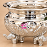 Detailed close-up of German silver Gandham Ginni highlighting the embossed decorative pattern, mirror-polished silver surface, wide rim and intricately shaped elephant legs.