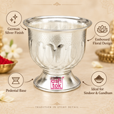 Features image of a German Silver Gandham Ginni and Sindoor Holder displayed on a premium beige background with elegant product callouts highlighting the German silver finish, embossed floral design, pedestal base and suitability for sindoor and gandham, while clearly showing the broad flared rim, rounded decorative body, repeating petal motifs, dotted detailing and polished silver appearance for customers looking for a traditional pooja accessory for daily worship, festive rituals and religious ceremonies.
