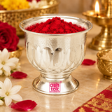 German Silver Gandham Ginni shown in a warm traditional puja setting filled with bright red sindoor powder, surrounded by tasteful white flowers, rose petals, brass puja accessories and a softly glowing lamp in the background, demonstrating practical use as a sindoor holder, gandham container, kumkum bowl or devotional offering vessel for daily worship, festive pooja, wedding ceremonies, religious functions and home mandir rituals without any deity idol in the scene.