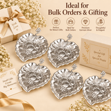 German silver gift item leaf-shaped dishes displayed for return gifts, festive gifting and bulk orders on a beige background.