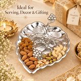 German silver gift item leaf-shaped serving dish styled with dry fruits, suitable for serving, home decor and gifting.