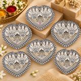 Multiple German Silver Haldi Kumkum Holders arranged for bulk gifting and festive presentation, featuring heart-shaped trays with twin flower-shaped bowls, detailed silver finish and traditional ornamental design, suitable for wedding return gifts, housewarming gifts, pooja gifts, festive giveaways and corporate gifting