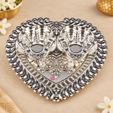 Top view of German Silver Haldi Kumkum Holder showing the full heart-shaped tray design, twin flower-shaped bowls, detailed decorative border, embossed central floral pattern and reflective silver finish, ideal for holding haldi and kumkum during pooja, wedding ceremonies, festive rituals, religious functions and traditional gifting