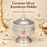 Feature presentation image of a German Silver Kumkum Holder displayed on a warm beige background with elegant product callouts highlighting the German silver finish, floral engraved design, stable pedestal base and suitability for puja use, while clearly showing the rounded container body, decorative domed lid, small top knob, intricate leaf and flower motifs and polished traditional appearance for daily worship, festive rituals, mandir accessories and gifting.
