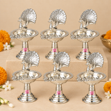 diya-bulk-gifting.jpg	Multiple German Silver Peacock Diyas arranged together for wedding return gifts, housewarming gifts, festive gifting, religious functions, corporate gifting and bulk gifting requirements