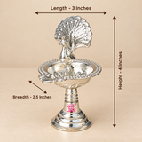 German Silver Peacock Diya size guide showing approximately 3 inches length, 2.5 inches breadth and 4 inches height with detailed peacock design, decorative bowl and pedestal stand