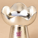 Close-up view of German Silver Puja Diya showing the smooth lotus petal shaped oil bowl, curved scalloped edges, bright reflective silver surface, fine texture and polished craftsmanship, highlighting the traditional decorative design suitable for pooja, festive ceremonies and gifting