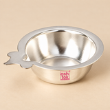 Top angle view of a traditional German Silver Puja Diya showing the smooth reflective inner bowl, broad circular rim, shallow rounded base and flat side wick-holder extension, photographed against a premium beige studio background with neutral silver reflections and soft lighting, providing a clear view of the diya interior and rim design for understanding how it can hold oil or ghee and support a cotton wick during daily puja and festive worship.