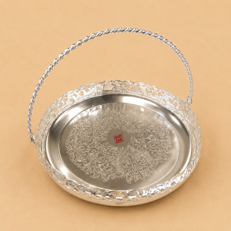 Round German Silver basket tray with twisted carry handle, engraved floral base, and decorative cutwork border for serving sweets, dry fruits, pooja, gifting, and home décor.