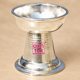 Front angle view of German Silver Round Diya showing the rounded oil lamp bowl, polished German silver surface, tapered pedestal body and wide circular base, designed for traditional pooja rituals, daily prayers, Diwali celebrations, festive decor, temple use, religious ceremonies, wedding functions and return gifting