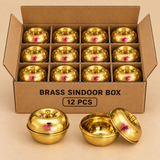 Brass sindoor box set packed in a normal cardboard packaging arrangement for 12 pieces, displayed neatly on a beige background, suitable for bulk gifting, return gifts, wholesale supply, and festive product presentation.
