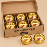 Brass sindoor box set in simple cardboard packaging for 6 pieces, shown on a beige background with an organized boxed arrangement, ideal for gifting packs, small bulk orders, and product packaging display.