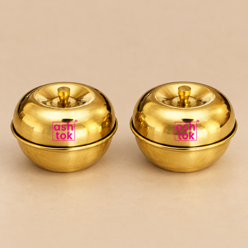 Gift item brass sindoor box set shown as two polished round brass containers with lids, placed side by side on a soft beige studio background, suitable for pooja use, return gifts, festive gifting, and everyday storage of kumkum or sindoor.