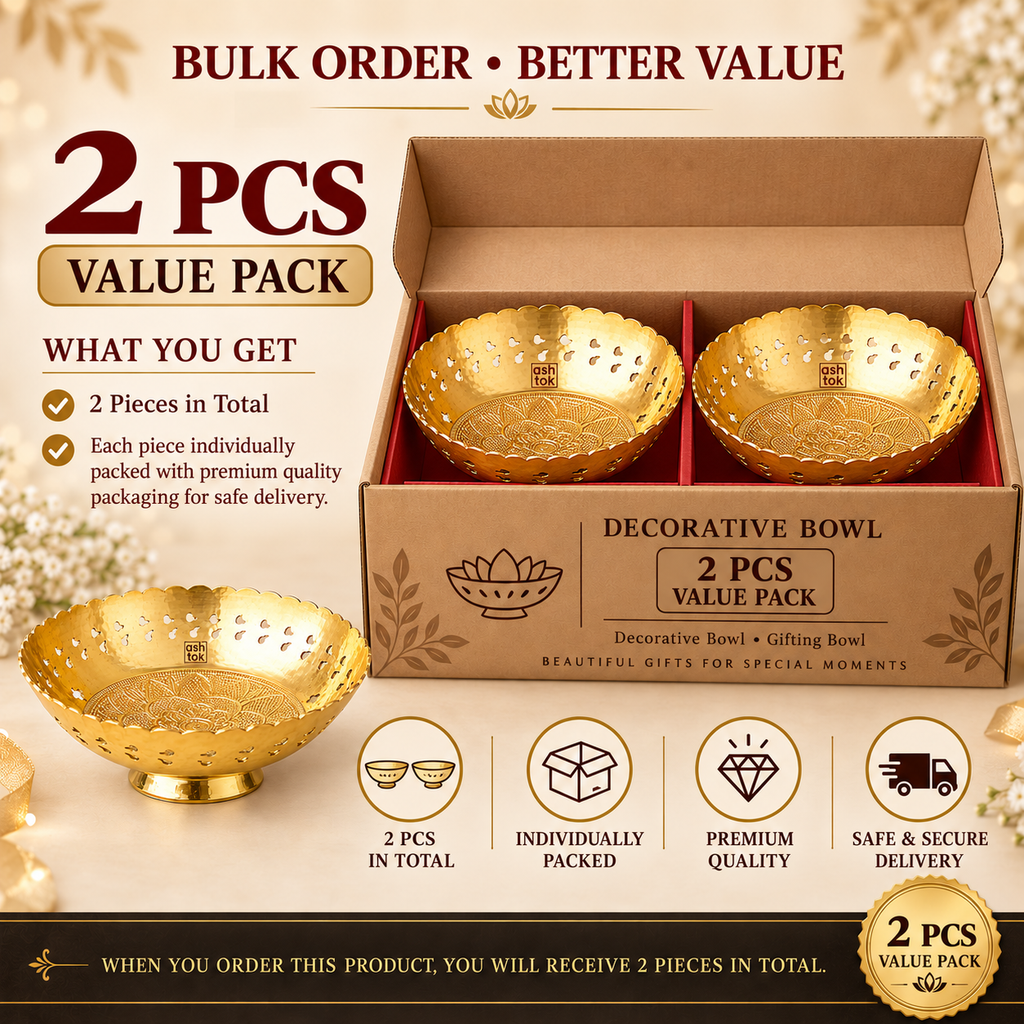 Set of 2 traditional gold coated decorative bowls displayed in a brown cardboard presentation box with individual compartments, alongside an additional sample bowl. Each piece features a polished golden finish, scalloped edges, pierced decorative cutouts, floral engraving inside the bowl and a raised pedestal base. Suitable for festive gifting, wedding return gifts, housewarming presents and decorative home accessories