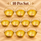 gift-basket-6-inch-10-piece-set.webp	Set of 10 gold coated flower gift baskets with handles arranged neatly on a warm beige display, each featuring a decorative scalloped rim, embossed floral and star detailing and curved carrying handle, suitable for wedding return gifts, festive gifting, family functions and event distribution.