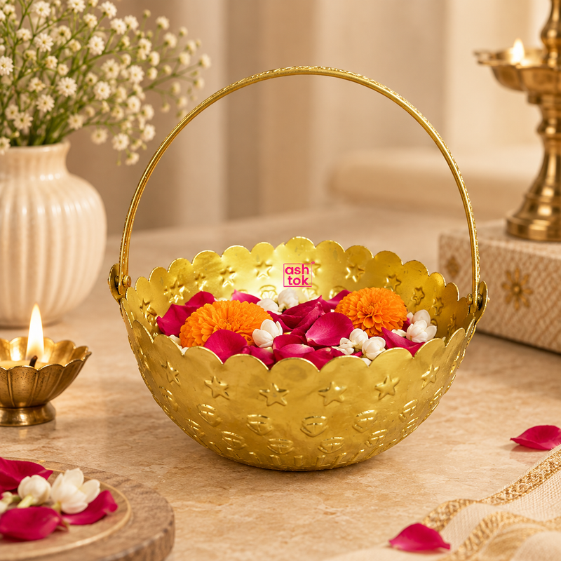 Gold coated flower basket styled with rose petals, marigold flowers and white blossoms in an elegant festive setting, showing its use for flower presentation, puja offerings, home decoration, weddings and special occasion gifting.
