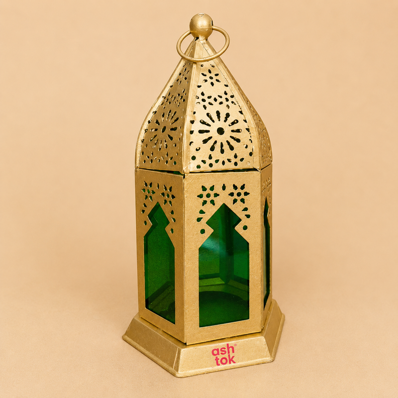 Decorative gold metal lantern with green glass panels and intricate cutout design, ideal for home décor, Ramadan, Diwali, festive displays, and candle lighting.