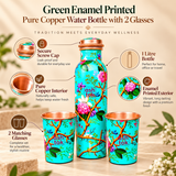 Product features infographic of a green enamel printed pure copper water bottle with two matching drinking glasses. Highlights include the pure copper interior, colourful turquoise-green enamel exterior with floral branch patterns, secure copper screw cap, 1 litre bottle capacity and two coordinating copper glasses. Suitable for everyday water serving, home use and gifting